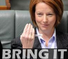 Julia Gillard on the front bench of the House of Representatives, signalling to the Opposition to "bring it on".