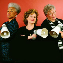 L-R: Gaye Adegbalola, Andra Faye,  Ann Rabson all holding megaphones