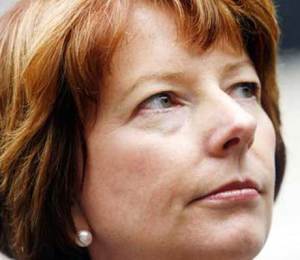 A portrait shot of Julia Gillard, looking away from the camera and upwards