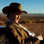 Stetsons are cool The Doctor played by Matt Smith is lounging on a car bonnet/windscreen in the American West, wearing a cowboy hat
