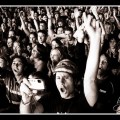 Black and white photograph of a rock festival audience crowd