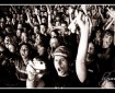 Black and white photograph of a rock festival audience crowd