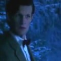 The Doctor, in bowtie and tweed, in a wintry forest at night. He looks concerned.