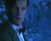 The Doctor, in bowtie and tweed, in a wintry forest at night. He looks concerned.