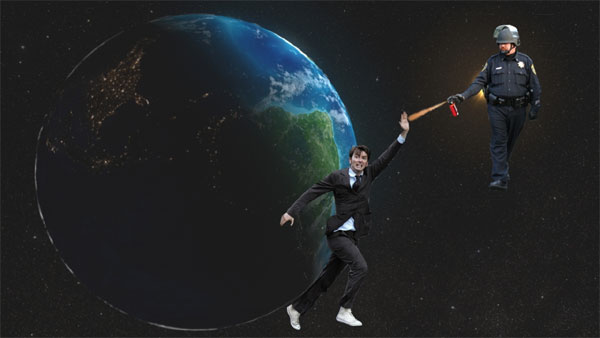 The Earth spins in space; approaching it is a policeman in riot gear spraying pepper spray; between him and the Earth stands the 10th Doctor with had upraised protectively