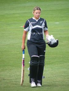 Suzie Bates stands with bat in the field