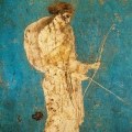 An ancient Roman fresco painting of Diana holding a bow and arrow.