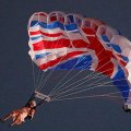 A stunt performer dressed as Queen Elizabeth II parachutes into the Olympic Stadium for the Opening Ceremony