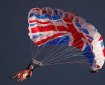 A stunt performer dressed as Queen Elizabeth II parachutes into the Olympic Stadium for the Opening Ceremony