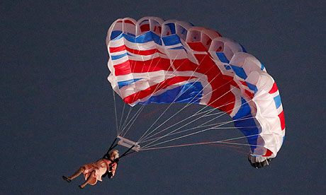 A stunt performer dressed as Queen Elizabeth II parachutes into the Olympic Stadium for the Opening Ceremony