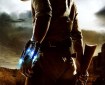 A man in desert canyon territory wearing Wild West costume is shown from behind, half-turning, holding a rifle in one hand and wearing a metal cuff with blue laser lights on his other wrist
