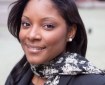 Headshot of Zerlina Maxwell, wearing a black and white scarf