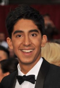 publicity headshot of Dev Patel, a young man of South Asian appearance