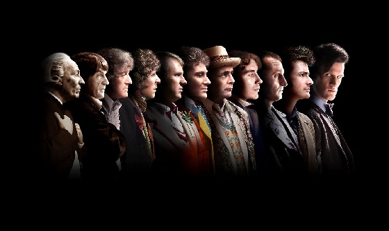 eleven doctors from #1 on left to #11 on right - the first 10 doctors are looking towards #11, who is looking into the camera