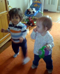 Two toddlers walking