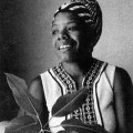 B&W of Maya Angelou as a young woman, in traditional African dress.
