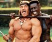Arnold Schwarzenegger and Grace Jones fooling around with sharp pointy things on the set of Conan The Destroyer