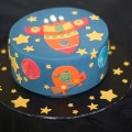 Cake decorated with rocket ship patterns