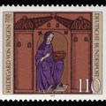Postage stamp showing medieval woodcut of nun in blue robe.