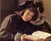 A 15th century painting of a boy reading, artist Frans Hals