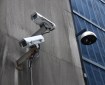 Surveillance cameras attached to a building exterior