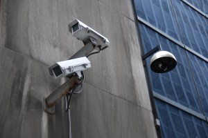 Surveillance cameras attached to a building exterior