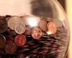 Glass jar containing US coins