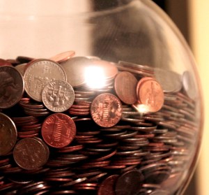 Glass jar containing US coins