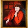 A portrait in oils of a woman wearing a red jacket and a pleasantly determined expression, resting her chin on one hand while gesturing towards the viewer with the other hand. She appears to have just made a persuasive argument.