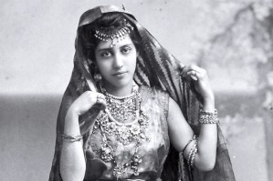 B&W photo of young Indian woman in traditional dress.